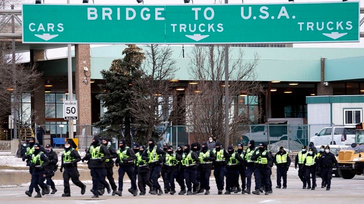 Canada police start to clear protesters blocking key US-Canada bridge