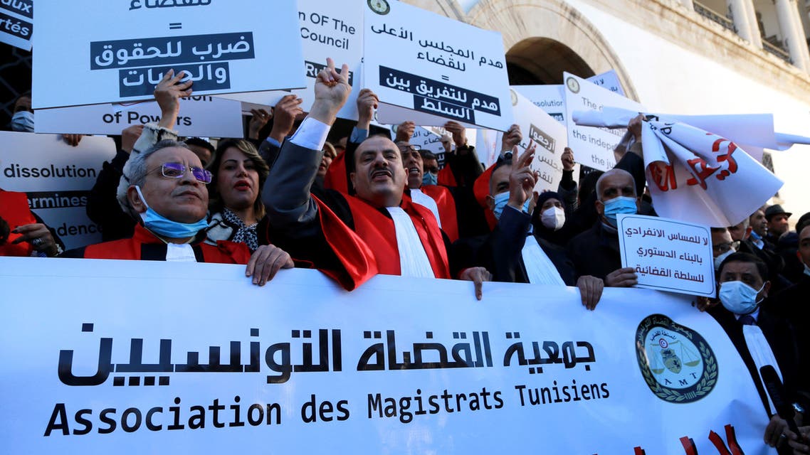 Tunisian judges shout slogans against the dissolution of the Supreme Judicial Council (CSM) by the Tunisian president, during a protest in Tunis on February 10, 2022. President Kais Saied on the weekend moved to scrap the CSM, accusing it of blocking politically sensitive investigations and being influenced by his nemesis, the Islamist-inspired Ennahdha party.