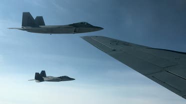 Two US Air Force F-22 stealth fighter jets are about to receive fuel mid-air from a KC-135 refueling plane over Norway en route to a joint training exercise with Norway's growing fleet of F-35 jets August 15, 2018. (Reuters)
