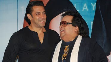 Bollywood actor Salman Khan (L) and music director and singer Bappi Lahiri smile during the music launch ceremony of their forthcoming movie “Main Aur Mrs. Khanna” (Me And Mrs. Khanna) in Mumbai September 8, 2009.  (Reuters)
