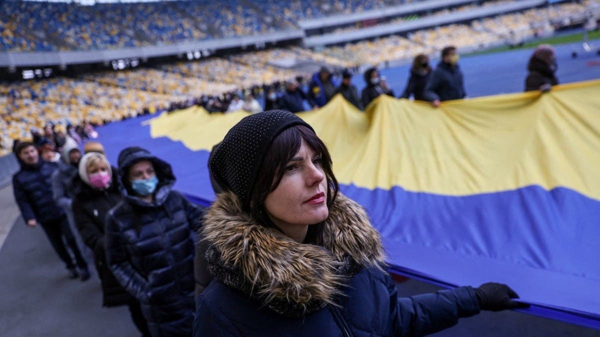 We fear no one:' Ukrainians raise flags, play anthem to defy