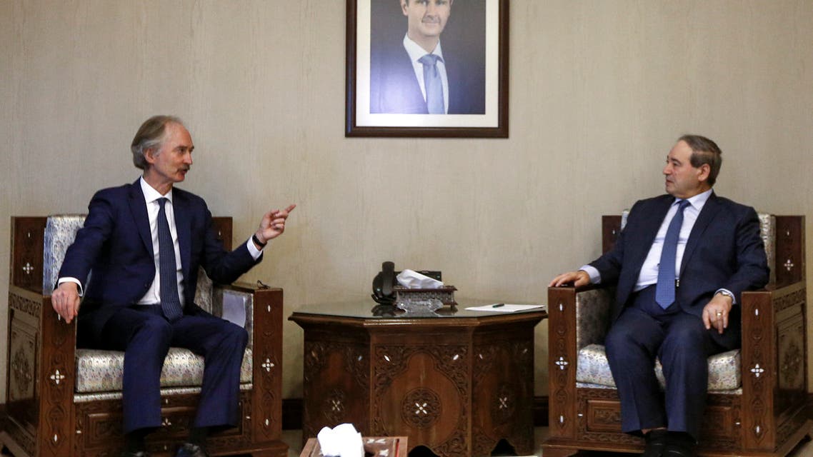 Syrian Foreign Minister Faisal Miqdad (R) receives the United Nations Special Envoy for Syria Geir Pedersen (L) in the capital Damascus, on February 16, 2022. (Photo by LOUAI BESHARA / AFP)