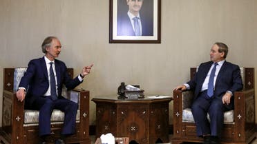 Syrian Foreign Minister Faisal Miqdad (R) receives the United Nations Special Envoy for Syria Geir Pedersen (L) in the capital Damascus, on February 16, 2022. (Photo by LOUAI BESHARA / AFP)