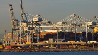 Container trucks , ships and cranes are shown at the Port of Long Beach as supply chain problem continue from Long Beach, California, U.S. November 22, 2021. (Reuters)