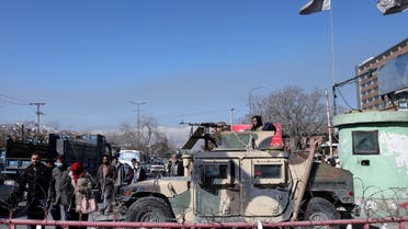 Afghans walk past a Humvee with a Taliban fighter on it guarding the road in Kabul, Afghanistan, January 27, 2022. (File Photo: Reuters)