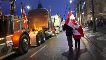 Protestors participate in a blockade of downtown streets near the parliament building as a demonstration organized by truck drivers opposing vaccine mandates continues on February 16, 2022 in Ottawa, Ontario,