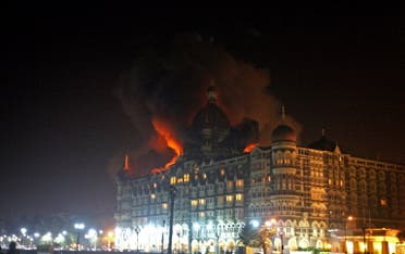 A fire breaks out of the dome of the Taj hotel in Mumbai on November 26, 2008. (AFP)