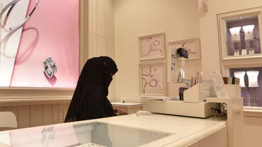 Saudi women sell jewelries at a retail store in Riyadh's Hayat mall on February 19, 2020. (AFP)