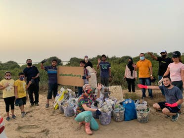 Safi Roshdy (center) and Ahlan Wa Sahlan volunteers at a clean-up drive in a mangrove forest in Umm Al Quwain on June 19, 2021. (Supplied)