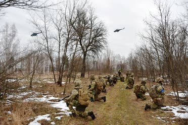 Service members of the Ukrainian Air Assault Forces take part in tactical drills at a training ground in an unknown location in Ukraine, in this handout picture released February 18, 2022. (Reuters)
