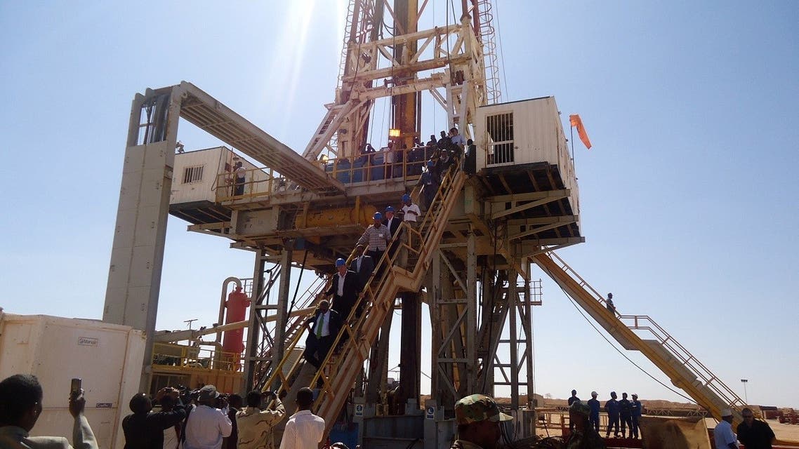 Engineers and visitors explore an exploratory well near Dharoor town, from the port of Bosasso on the Gulf of Aden in