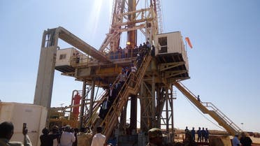 Engineers and visitors explore an exploratory well near Dharoor town, from the port of Bosasso on the Gulf of Aden in 