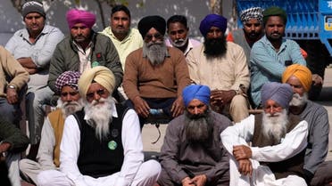 A group of village elders listen to the speech of one of the candidate contesting for the state assembly elections in village Derra Bassi, in Indian state of Punjab, on February 14, 2022. (AP)