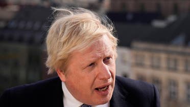 British Prime Minister Boris Johnson speaks during an interview amid the Munich Security Conference in Munich, Germany, on February 19, 2022. (Reuters)