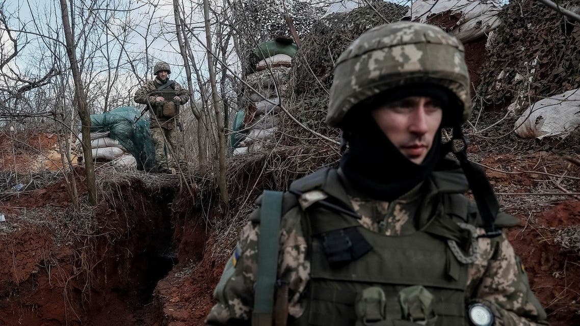 Ukrainian service members are seen on the front line near the city of Novoluhanske in the Donetsk region, Ukraine, on February 20, 2022. (Reuters)