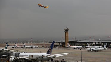This picture taken on December 21, 2021 shows an Airbus A306 aircraft of international courier company DHL taking off from Israel's Ben Gurion Airport in Lod, east of Tel Aviv. Israeli lawmakers on December 21 banned citizens and residents from US travel, adding it to a list of more than 50 countries declared off-limits in an effort to contain the Omicron coronavirus variant. (Photo by GIL COHEN-MAGEN / AFP)