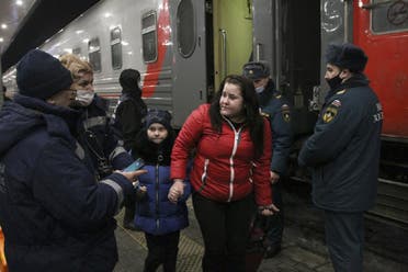 People from the Donetsk region, the territory controlled by a pro-Russia separatist government in eastern Ukraine, leave a train to be taken to temporary housing, at the railway station in Nizhny Novgorod, Russia, on February 22, 2022. (AP)