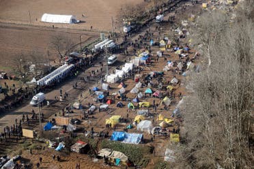 This handout aerial picture taken from a helicopter and released on March 5, 2020 by the Turkish Interior ministry shows migrant camps at the Turkish-Greek border near Edirne a day after migrants and refugees clash with Greek police following Turkey's decision to open its borders to allow migrants through to Europe. (AFP)