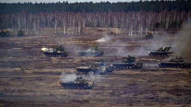 This handout video grab released by the Russian Defence Ministry on February 21, 2022, shows Russian and Belarus tanks during joint exercises of the armed forces of Russia and Belarus as part of an inspection of the Union State's Response Force, at a firing range near Brest. (AFP)
