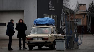 Local residents are seen refueling at gas station after Russian President Vladimir Putin authorized a military operation in eastern Ukraine, in Mariupol, on February 24, 2022. (Reuters)