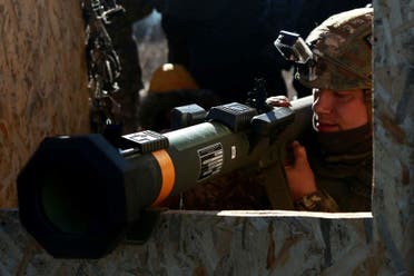 A service member of the Ukrainian Armed Forces levels a weapon during military drills at a firing ground in the Donetsk region, Ukraine, February 15, 2022. (Reuters)