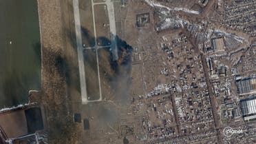 This handout satellite photo released by Planet Labs PBC shows a explosion at Chuhuiv Airbase outside of Kharkiv, Ukraine, on February 24, 2022. (AFP)