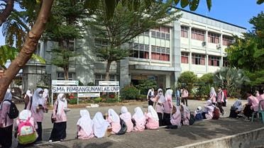 Primary school students evacuate from the school building after a 6.2 magnitude earthquake in Sumatra Island, Indonesia, February 25, 2022. (Reuters)