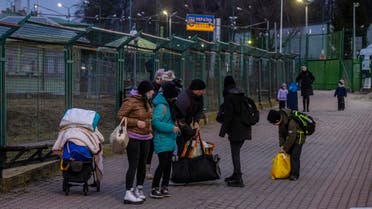 Ukrainian citizens are seen arriving at the Medyka pedestrian border crossing in eastern Poland on February 25, 2022. (AFP)