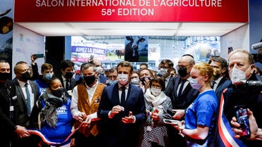 France's President Emmanuel Macron applauds after inaugrating the Paris International Agricultural Show (Salon International de l'Agriculture) at the Porte de Versailles exhibition center in Paris, France, February 26, 2022. (Reuters)