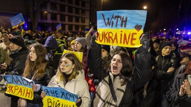 Demonstrators take part in the protest against Russia's agression on Ukraine, in front of Russian embassy in Warsaw, on February 24, 2022. (AFP)