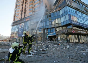 Firefighters extinguish fire in an apartment building damaged by recent shelling in Kyiv, Ukraine February 26, 2022. (Reuters)