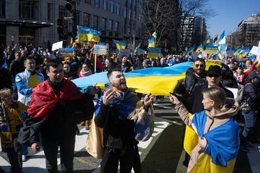 People rally for more U.S. support for Ukraine, after the Russian invasion in Ukraine, near the White House in Washington, US, on February 27, 2022. (Reuters)