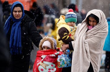 People fleeing Russian invasion of Ukraine arrive at a temporary camp in Przemysl, Poland, February 28, 2022. (Reuters)