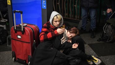 People take shelter in a metro station in Kyiv on February 24, 2022. (AFP)
