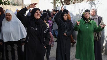 Palestinian women mourn during the funeral of a man killed by Israeli forces during an arrest raid in Jenin in the northern West Bank on March 1, 2022. (AFP)