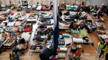 People who fled from Ukraine because of Russian invasion rest at the sports hall of an elementary school in the town of Lubycza Krolewska, in Lublin province, Poland on March 1, 2022. (Reuters)