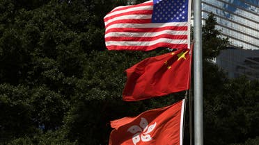 Flags of China, Hong Kong and the US fly next to each other along in Hong Kong. (File Photo: Reuters)