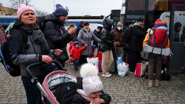 People fleeing Russia's invasion of Ukraine attempt to get to Poland at a long distance bus terminal in Lviv, Ukraine March 2, 2022. REUTERS/Thomas Peter