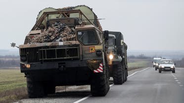 A Ukrainian rocket launcher vehicle drives west of the coastal city of Mariupol, after Russian President Vladimir Putin authorized a military operation in eastern Ukraine, in Mariupol, February 24, 2022. (Reuters)