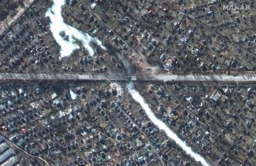 A satellite image shows a damaged bridgeroad and nearby homes, in Chernihiv, Ukraine, February 28, 2022. (Reuters)