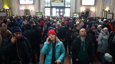 People check for trains departing to Poland following Russia?s invasion of Ukraine at the main train station in Lviv, Ukraine, March 4, 2022. (Reuters)