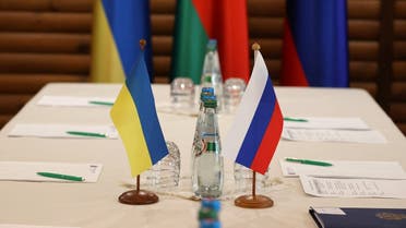 Ukrainian and Russian flags are seen on a table before the talks between officials of the two countries in the Brest region, Belarus March 3, 2022. (Maxim Guchek/BelTA/Handout via Reuters )