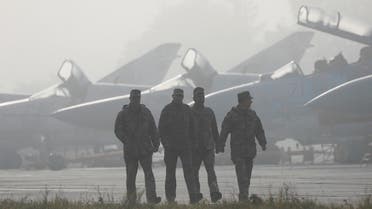 File photo of Ukrainian servicemen walking past fighter jets ahead of multinational military drills at Starokostiantyniv Air Base in Khmelnytskyi Region, Ukraine. (Reuters)