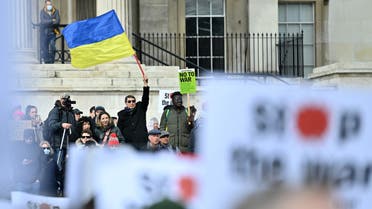 A demonstrator waves a Ukrainian flag in Trafalgar Square during a protest rally for a Stop the War in Ukraine Global Day of Action, in central London, on March 6, 2022 as part of an international day of anti-war action, prompted by Russia's invasion of Ukraine.