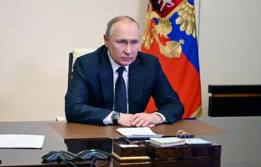 Russian President Vladimir Putin chairs a meeting with members of the Security Council via teleconference call at the Novo-Ogaryovo state residence outside Moscow, Russia, on March 3, 2022. (AFP)