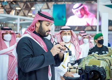 Crown Prince Mohammed bin Salman inspects military technology at the first World Defense Show outside of Riyadh on March 6 2022. (SPA)
