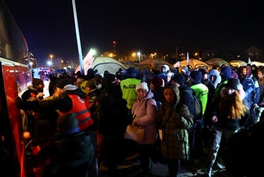 لاجئون أوكران فروا إلى بولندا - رويترز 