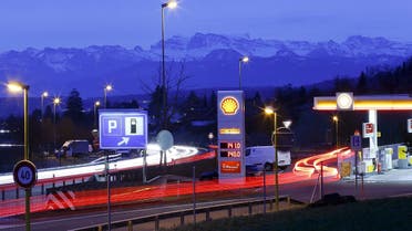 Traffic on the A52 motorway passes a Shell gas station near the village of Hinteregg, Switzerland. (Reuters)