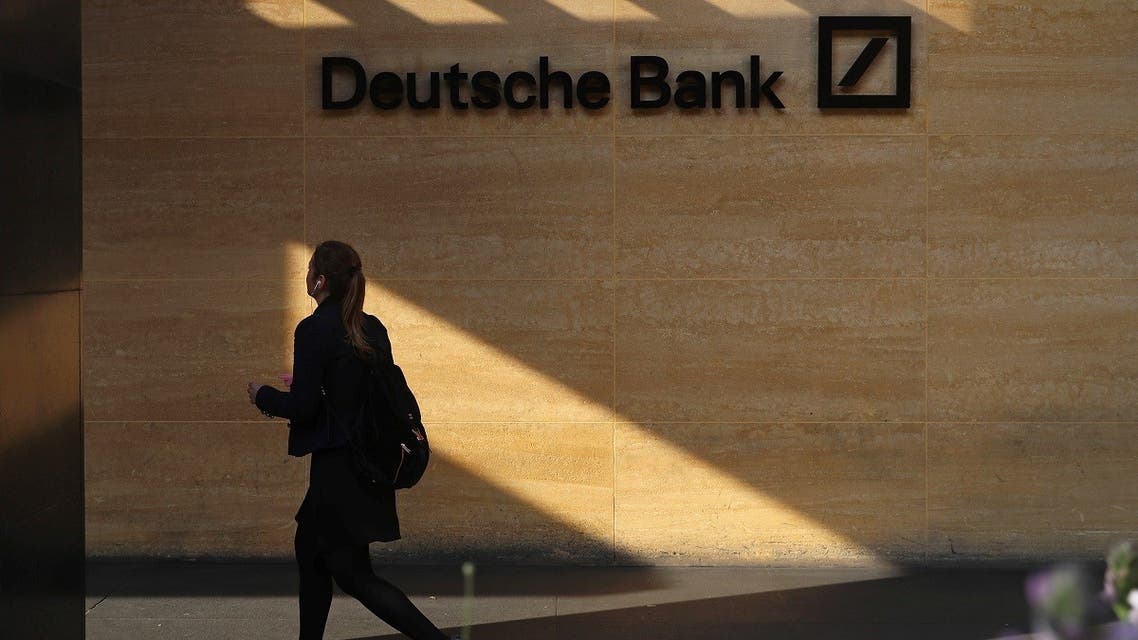 A woman walks past a Deutsche Bank office in London, Britain. (Reuters)