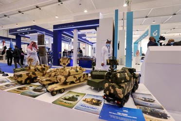Saudi men are seen looking at Russian defence system models on display at World Defense Show in Riyadh, Saudi Arabia, March 6, 2022. REUTERS/Ahmed Yosri
